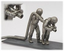 Two Formula 1 Refuellers With Hose